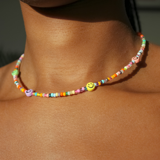 Colorful pearl necklace with happy smiles 